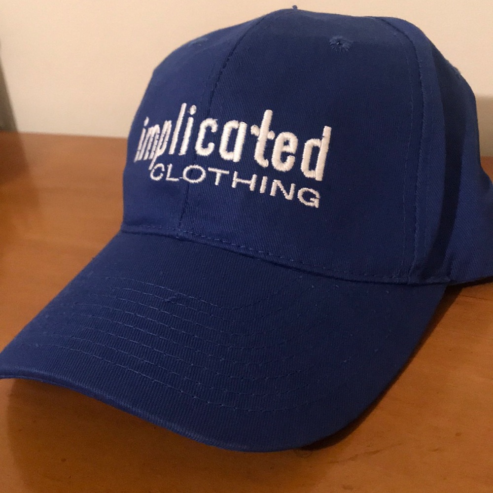 Blue “Implicated Clothing” dad hat